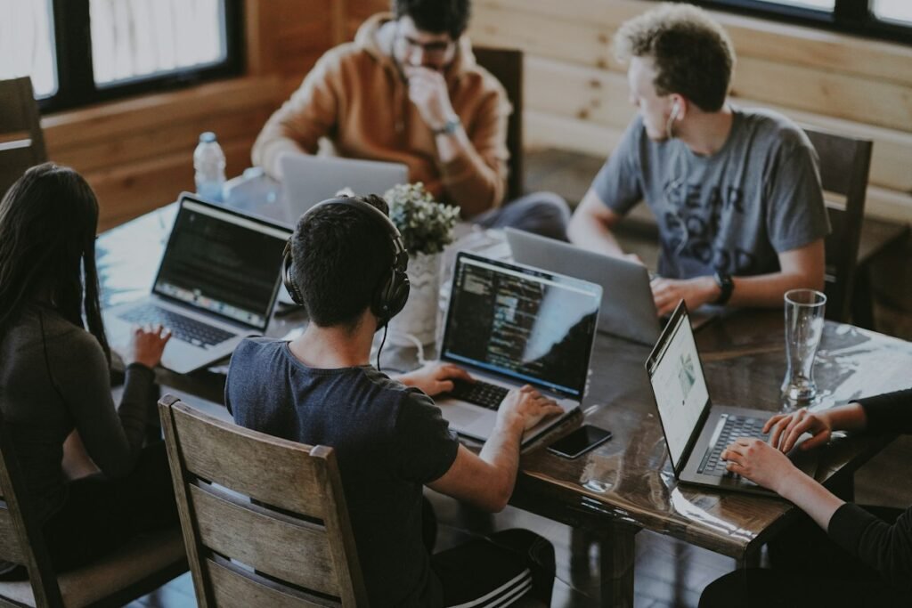Marketing team planning a campaign on laptops